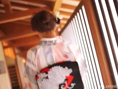 Alluring Japanese babe is happy to play with a couple of cocks