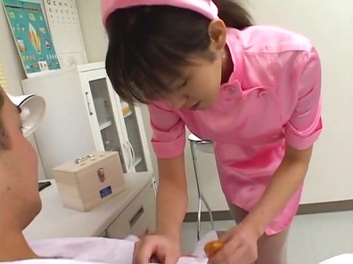 Seductive Nurse in Pink Uniform Teases Patient Before Oral Pleasure Begins