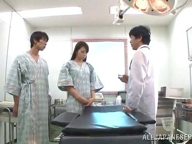 Kinky doctors probe a Japanese girl's hairy pussy in an exam room