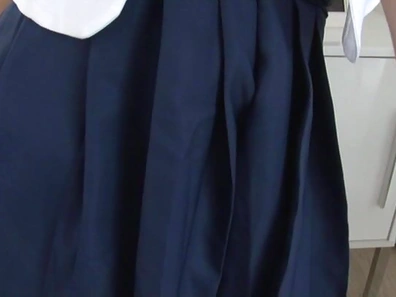 Schoolgirl with glasses gives a sensual striptease