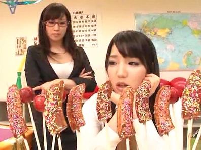 Naughty Japanese teen girls lick candies and suck hard real cock