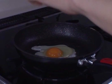 Asian cutie Anri Okita gets fucked in the kitchen by two guys