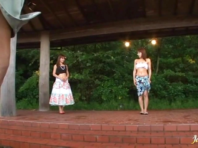 Beautiful mature Japanese woman outdoors and st-down